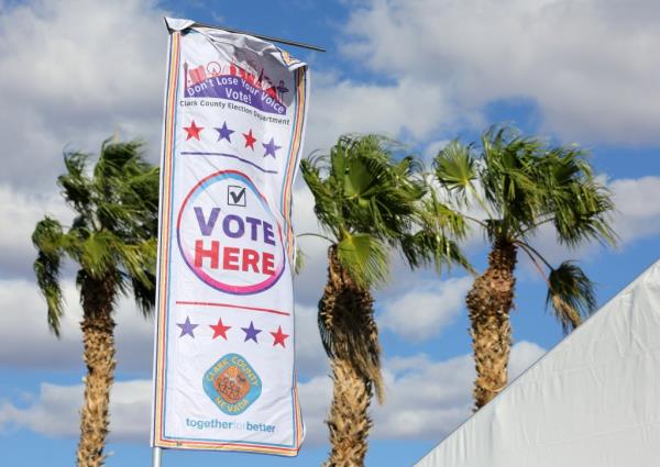 Banner marking a voting site flapping in the high winds at the Thunderbird Family Sports Complex, Las Vegas, during early voting in 2024