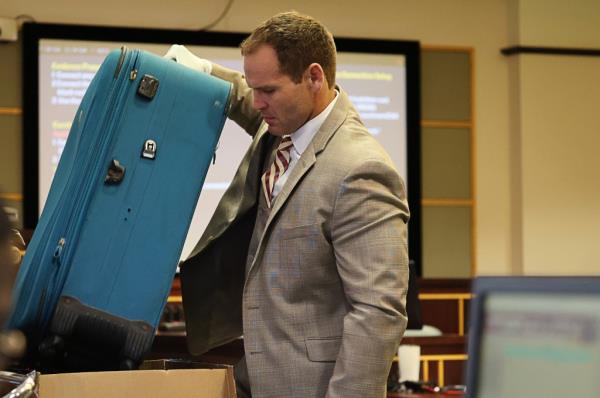 Prosecutor Dave Cacciatore Jr. takes out the suitcase in evidence as he begins the closing arguments in Defendant Sarah Boone's trial, Friday, Oct. 25, 2024.