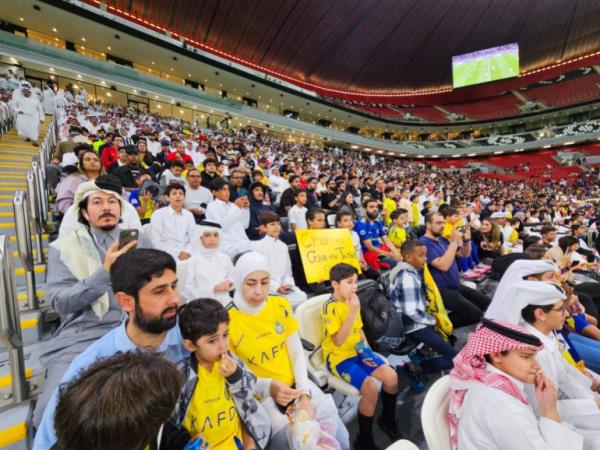 Football fans at the AFC Champions League Elite Group B match between Al Gharafa SC of Qatar and Al Nassr FC at the Al Bayt Stadium in Al Khor, Qatar [Hafsa Adil/Al Jazeera]
